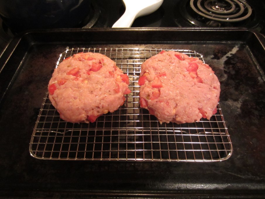 Raw turkey burger patties in oven